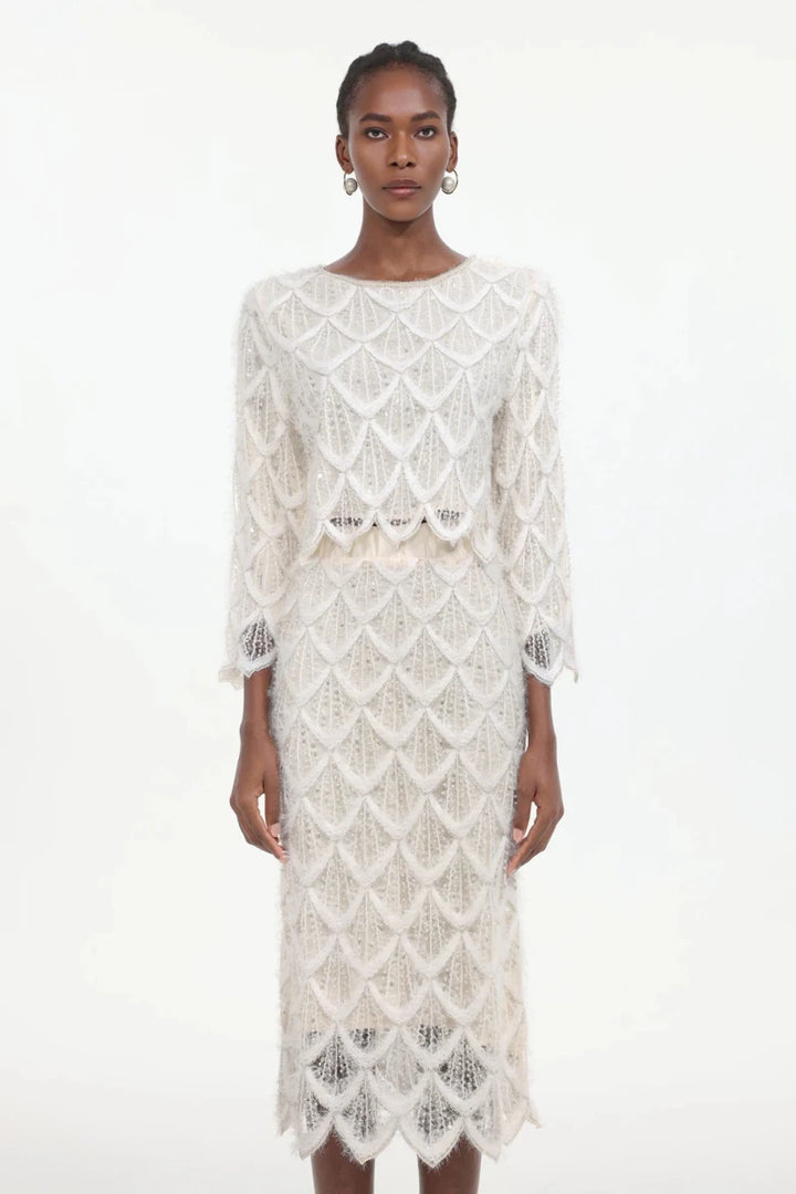 Full length lace dress and jacket set showing fitted silhouette